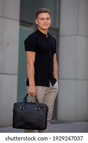 Young  Business Man In Classic Look Walking On The Street With Briefcase Designer Leather Laptop Satchel Portfolio Messenger Bag.  Different Color Of Bag And No Logo.