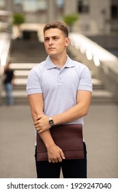 Young  Business Man In Classic Look Walking On The Street With Briefcase Designer Leather Laptop Satchel Portfolio Messenger Bag.  Different Color Of Bag And No Logo.