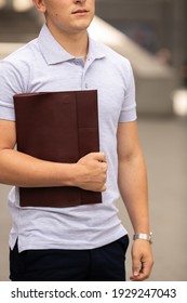 Young  Business Man In Classic Look Walking On The Street With Briefcase Designer Leather Laptop Satchel Portfolio Messenger Bag.  Different Color Of Bag And No Logo.