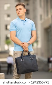 Young  Business Man In Classic Look Walking On The Street With Briefcase Designer Leather Laptop Satchel Portfolio Messenger Bag.  Different Color Of Bag And No Logo.