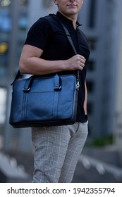 Young  Business Man In Classic Look Walking On The Street With Briefcase Designer Leather Laptop Satchel Portfolio Messenger Bag.  Different Color Of Bag And No Logo.