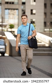 Young  Business Man In Classic Look Walking On The Street With Briefcase Designer Leather Laptop Satchel Portfolio Messenger Bag.  Different Color Of Bag And No Logo.