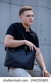 Young  Business Man In Classic Look Walking On The Street With Briefcase Designer Leather Laptop Satchel Portfolio Messenger Bag.  Different Color Of Bag And No Logo.