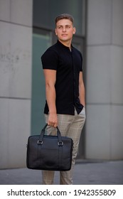 Young  Business Man In Classic Look Walking On The Street With Briefcase Designer Leather Laptop Satchel Portfolio Messenger Bag.  Different Color Of Bag And No Logo.