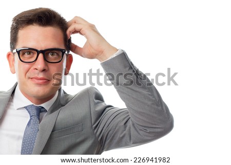 Young business man close up over white background. Looking confused