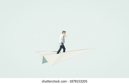 Young Business Man Flies On A Paper Plane. Concept Of Unconventional Solution And Brainstorming