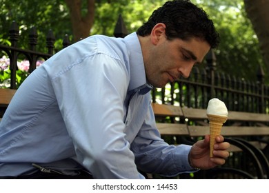young business man with ice cream cone