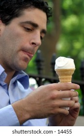 young business man with ice cream cone