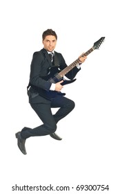 Young Business Man Jumping And Playing Guitar Isolated On White Background