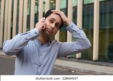 Young Business Man Looking Fed Up.