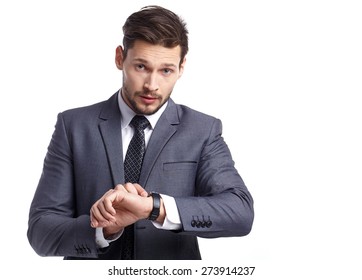 Young Business Man  Looking At Watch Over White Background