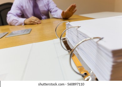 Young Business Man In The Office Sitting In Front Of The Folder Refuse To Work Rejects Offer Stock Photo Selective Focus