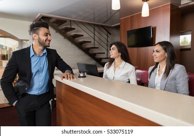 Young Business Man On Hotel Reception Office, Businessman Check In Formal Trip Arrive Woman At Front Desk Meeting Stuff