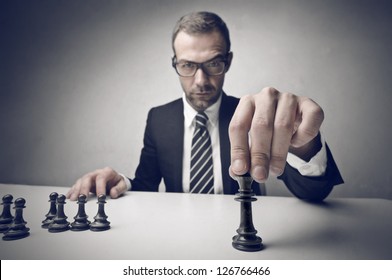 Young Business Man Playing Chess