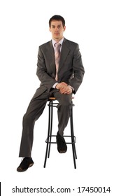 Young Business Man Sits On Stool