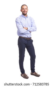 Young business man standing with arms crossed on a white background