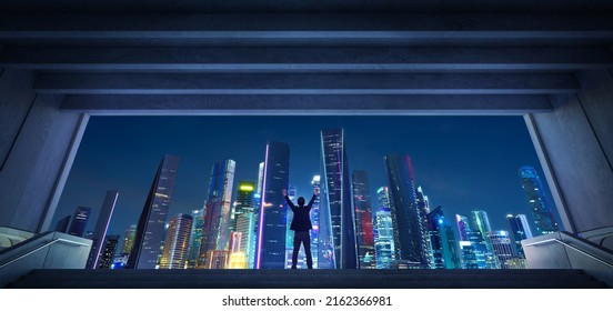 Young Business Man Standing In The Exit Of The Underground Facing The Night Thriving Modern City, Business Ambition Concept.