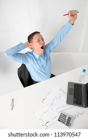 Young Business Man Stretching His Arms While Yawning