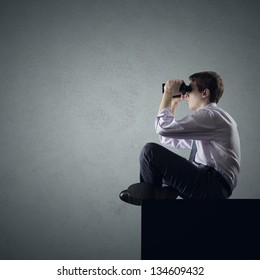 Young Business Man Or Student Looking Through Binoculars