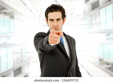 Young Business Man In A Suit Pointing With His Finger