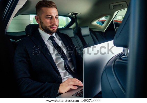 Young business man test\
drive new car.