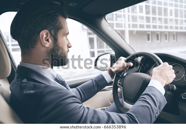 Young business man\
test drive new car
