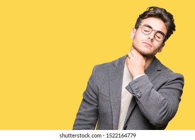 Young Business Man Wearing Glasses Over Isolated Background Touching Painful Neck, Sore Throat For Flu, Clod And Infection