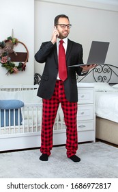 Young Business Man Work From Home During Coronavirus Pandemic Quarantine. Handsome Man In Suit And Pajama Pant Working From Home Office. Freelance Work. Working Online. 