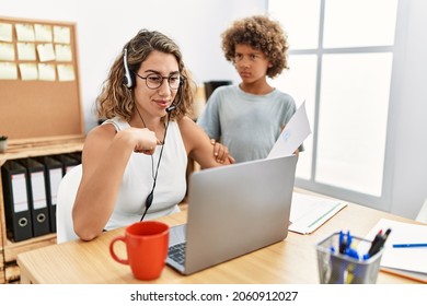 Young Business Mother Working At The Office With Kid Pointing Finger To One Self Smiling Happy And Proud 