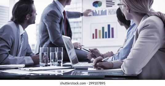Young business people in board room meeting at the office - Shutterstock ID 299107895