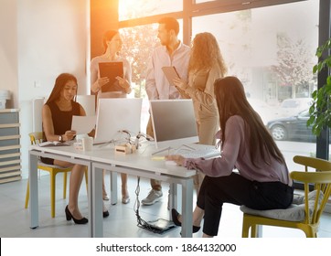 Young Business People In Discussion, Mixed Race. Creative Team Meeting In Modern Work Space. We Are Stronger Together. Female Chef. An Empowered Workplace.