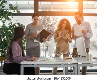 Young Business People In Discussion, Mixed Race. Creative Team Meeting In Modern Work Space. We Are Stronger Together. Female Chef. An Empowered Workplace.