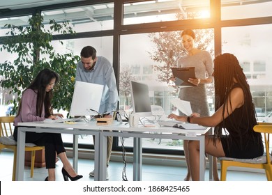 Young Business People In Discussion, Mixed Woman Race. Creative Team Meeting In Modern Work Space. We Are Stronger Together. Female Chef. An Empowered Workplace.