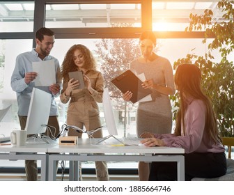 Young Business People In Discussion, Mixed Race. Creative Team Meeting In Modern Work Space. We Are Stronger Together. Female Chef. An Empowered Workplace.