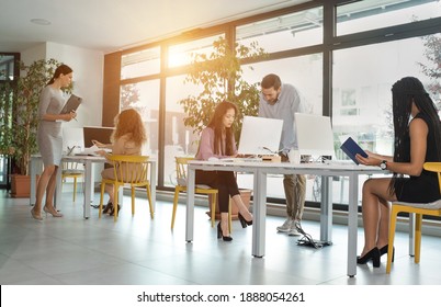 Young Business People In Discussion, Mixed Woman Race. Creative Team Meeting In Modern Work Space. We Are Stronger Together. Female Chef. An Empowered Workplace.