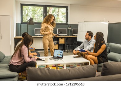 Young Business People In Discussion, Mixed Woman Race. Creative Team Meeting In Modern Work Space. We Are Stronger Together. Female Chef. An Empowered Workplace.