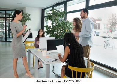 Young Business People In Discussion, Mixed Race. Creative Team Meeting In Modern Work Space. We Are Stronger Together. Female Chef. An Empowered Workplace.