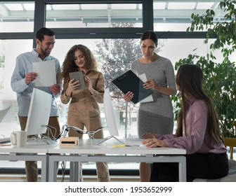 Young Business People In Discussion, Mixed Race. Creative Team Meeting In Modern Work Space. We Are Stronger Together. Female Chef. An Empowered Workplace.