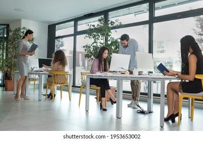 Young Business People In Discussion, Mixed Woman Race. Creative Team Meeting In Modern Work Space. We Are Stronger Together. Female Chef. An Empowered Workplace.