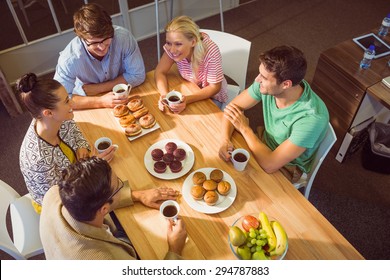 Young Business People Having Dessert After Lunch