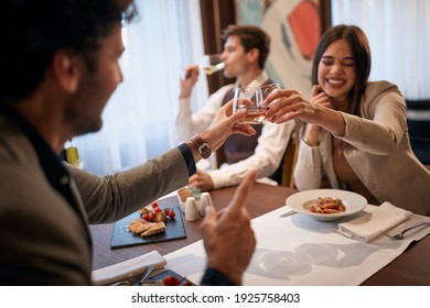 Young business people having good time at business lunch in a relaxed atmosphere at the restaurant. Business, restaurant, lunch