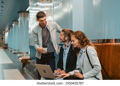 Young Business People With A Laptop On The Subway Platform.