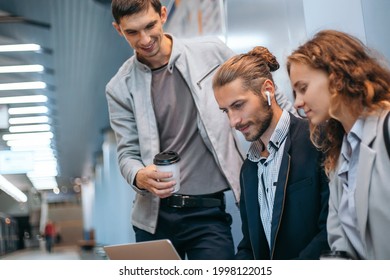 Young Business People With A Laptop On The Subway Platform.