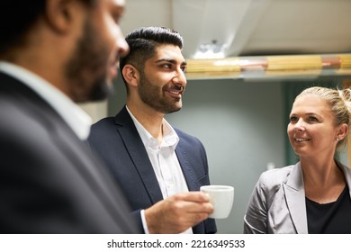 Young Business People Making Small Talk With A Cup Of Coffee On A Break After A Meeting