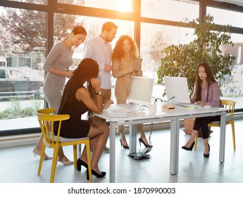 Young Business People Mixed Race In Discussion, Brainstorming. Creative Team Meeting In Modern Work Space. We Are Stronger Together. Female Chef. An Empowered Workplace.