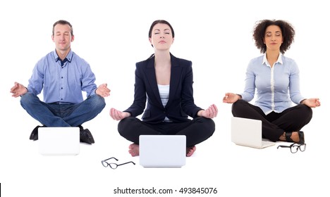 young business people sitting in yoga pose with laptops isolated on white background