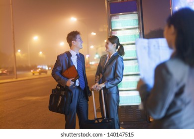 Young Business People Waiting For A Bus