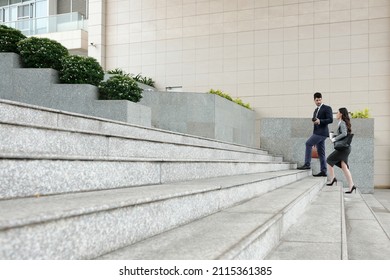 Young Business People Walking Up The Stairs When Hurrying To Work In The Morning