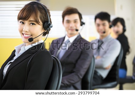 young business people working with headset in office