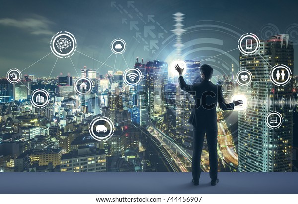 young\
business person and graphical user interface concept. Artificial\
Intelligence.  Internet of Things. Information Communication\
Technology. Smart City. digital\
transformation.